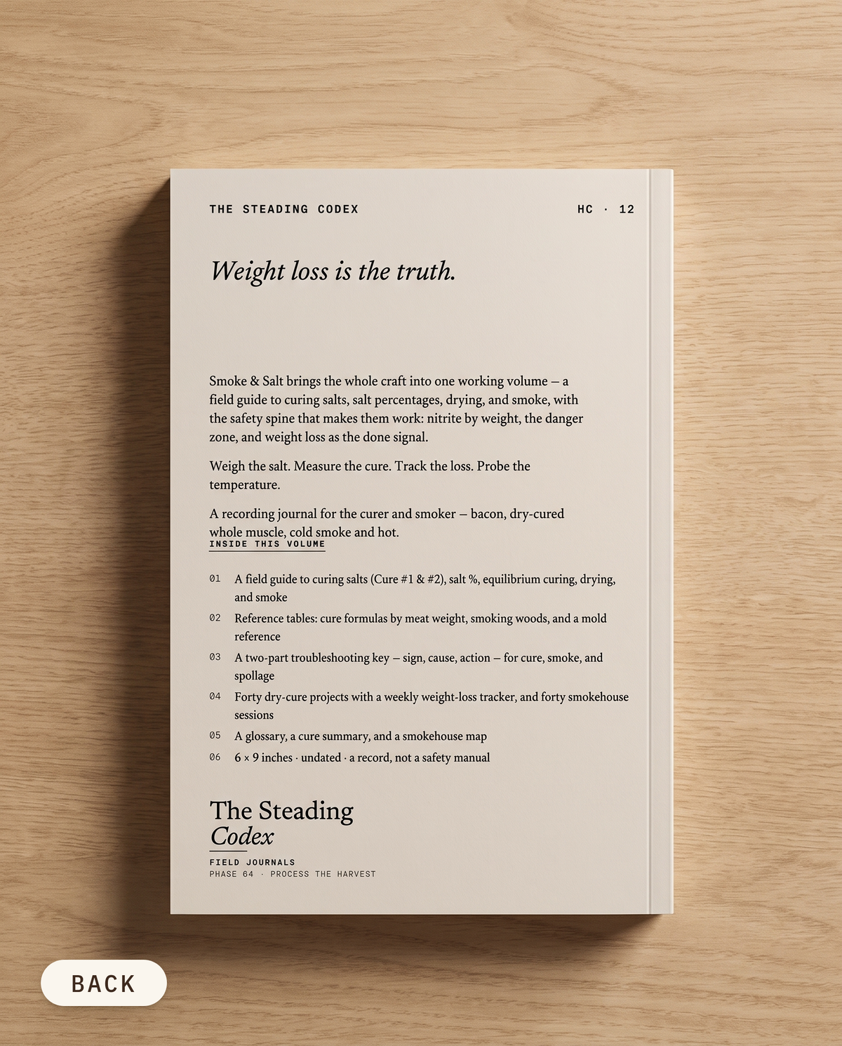 Smoke & Salt curing and smoking journal — back cover on an oak table